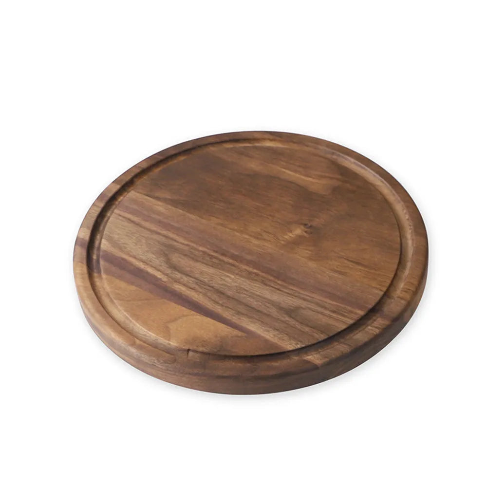 Solid black walnut wood chopping board with juice groove, available in round or rectangular sizes.
