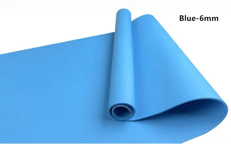 Red EVA fitness composite yoga mat with rolled edge showing 4mm thickness on a wooden floor.