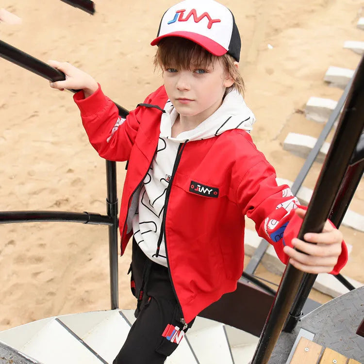 JLNY children's sports jacket in Black with standing collar and letter design on a white background