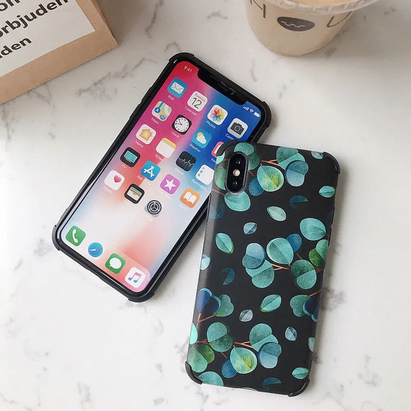 Black silicone iPhone case featuring a raised leaf pattern design on the back.