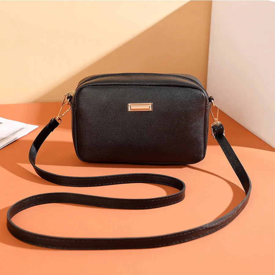 Solid colour minimalist ladies shoulder bag in PU leather with a three-dimensional pocket
