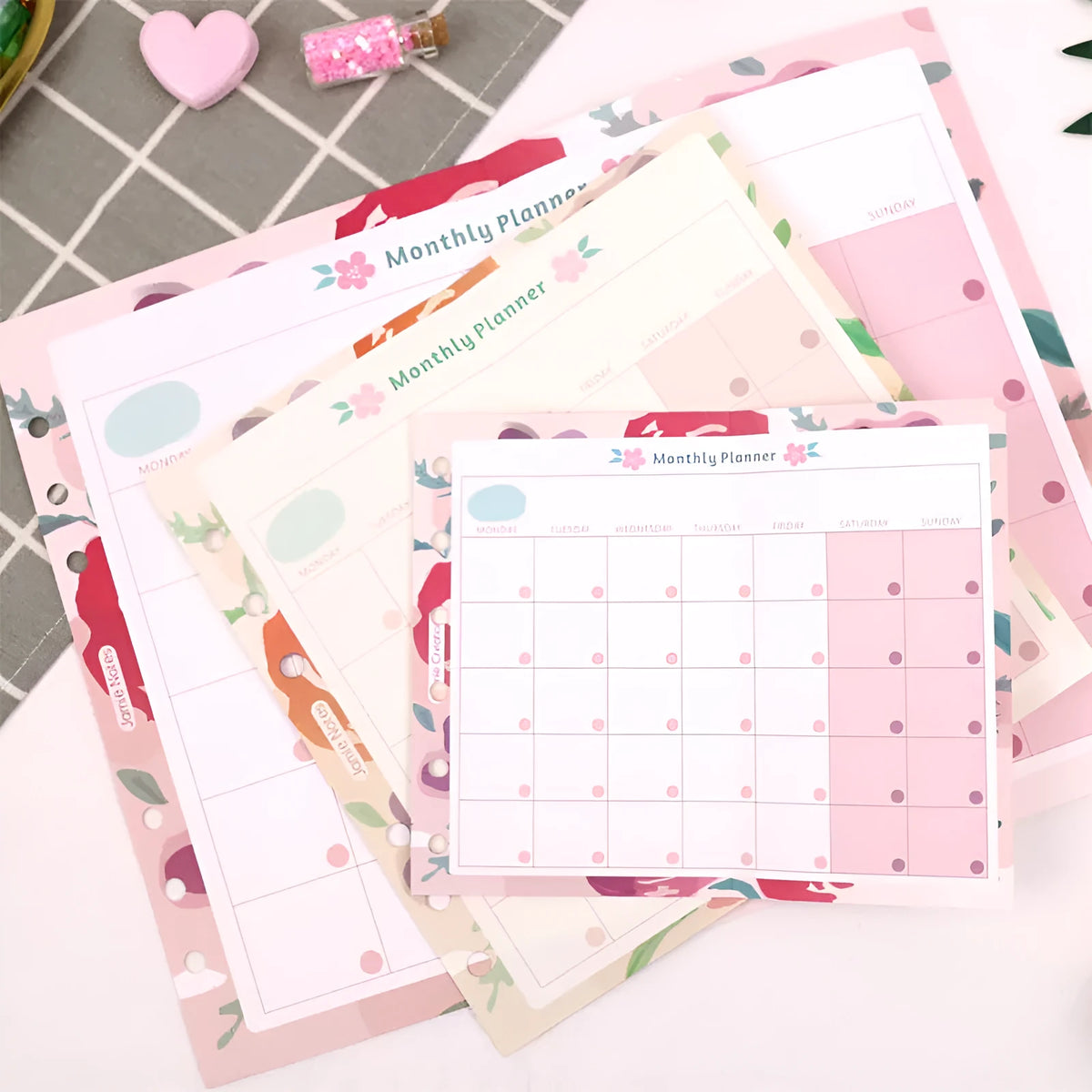 Loose-leaf refill sheets in A5, A6, and A7 sizes with floral and tri-fold planner designs