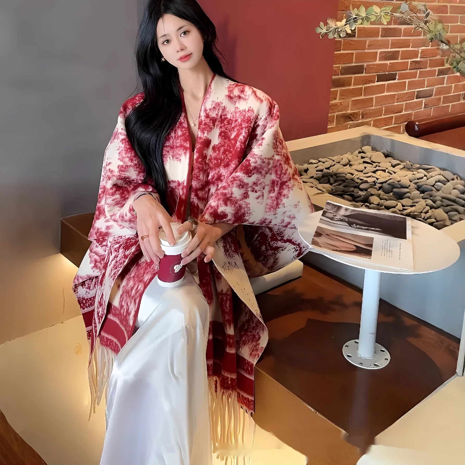 Women modelling a lightweight polyester scarf cape with tassels in a casual shawl style.