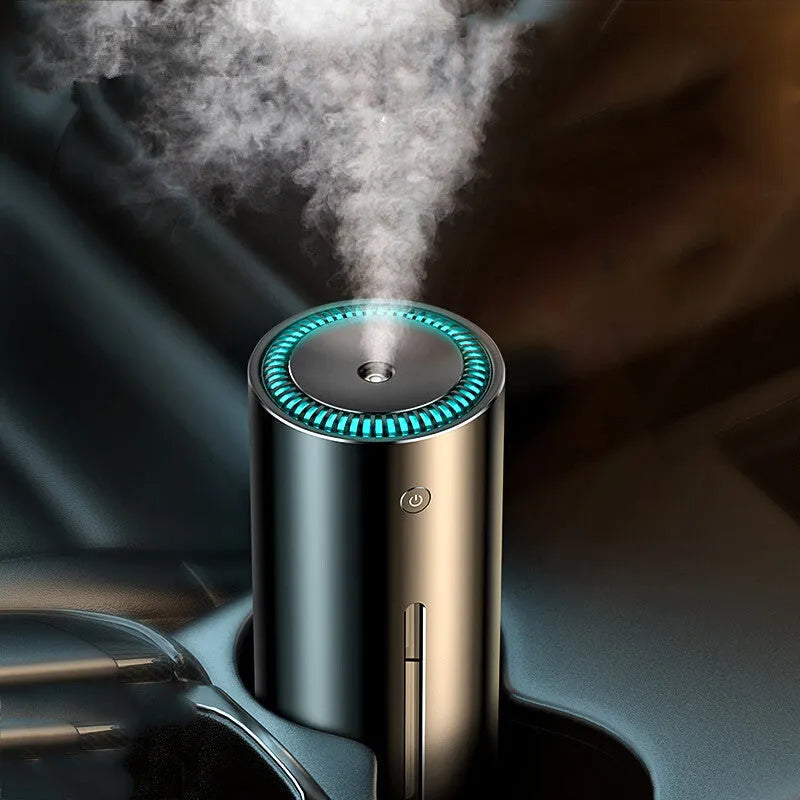 Black aluminium alloy car diffuser humidifier with USB cable, emitting cool mist for vehicle or desktop use.