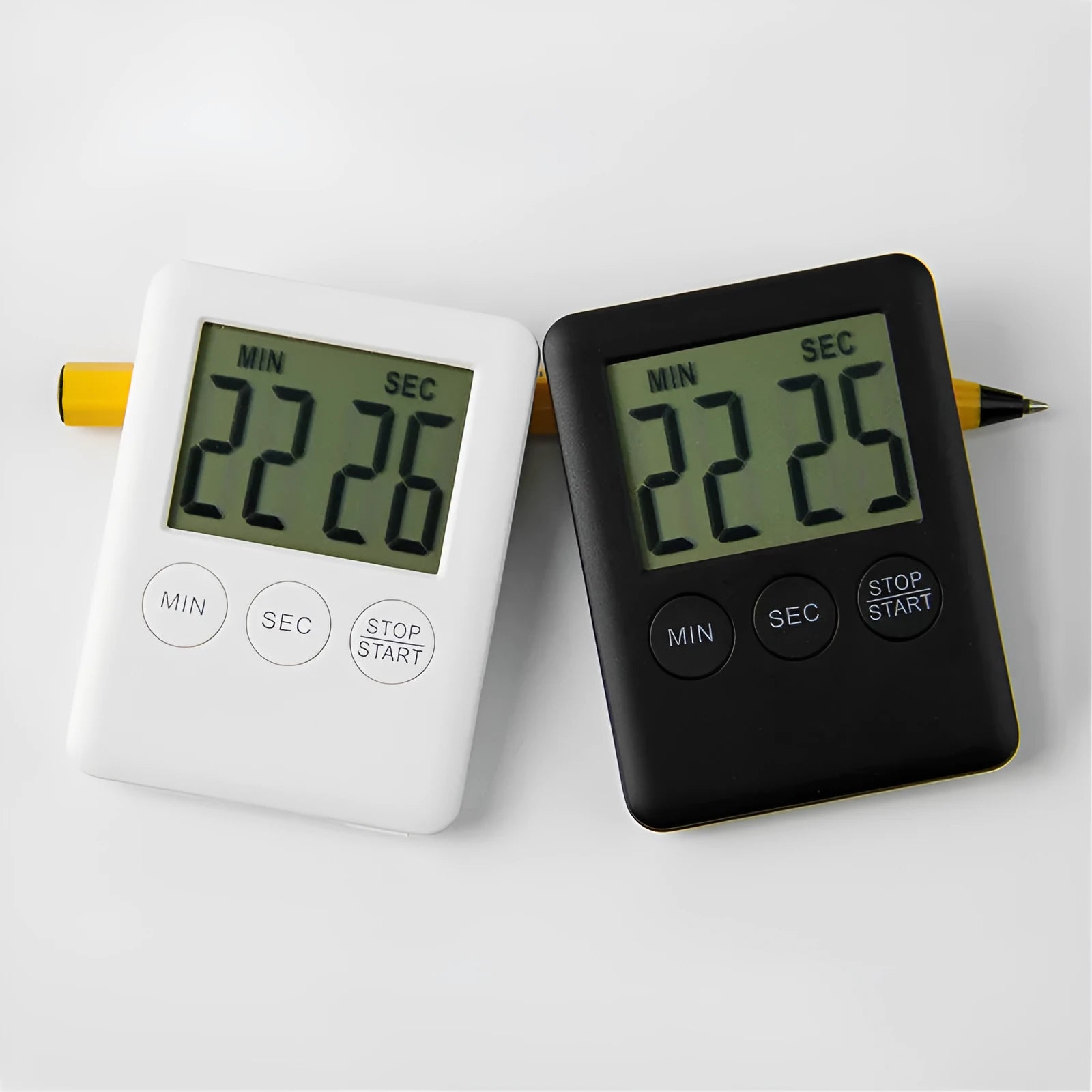 Black and white digital kitchen timer with magnet back, flip-out stand, and large LCD display.