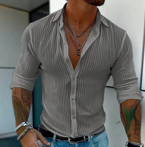 A man's loose-fit striped cardigan shirt with long sleeves in a British style design.