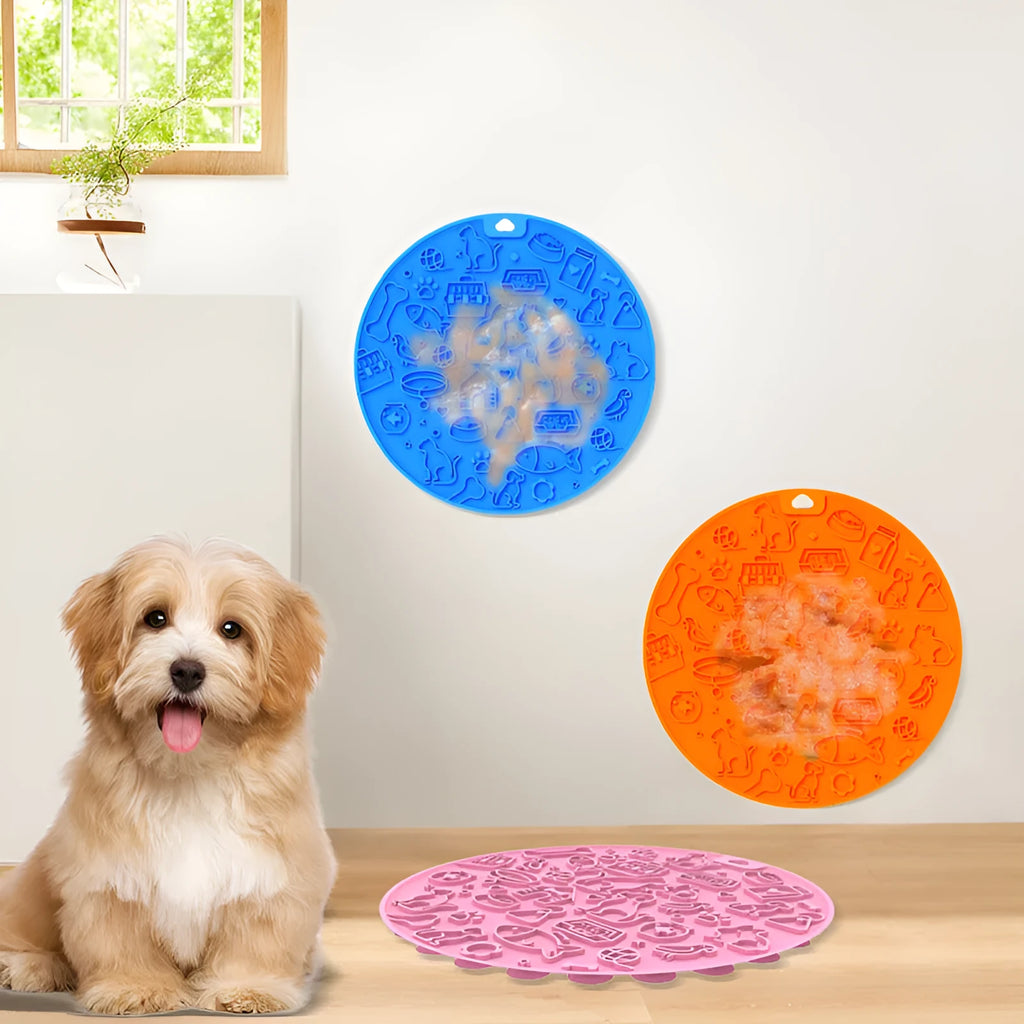 Round grey silicone pet lick mat with suction base on a kitchen floor