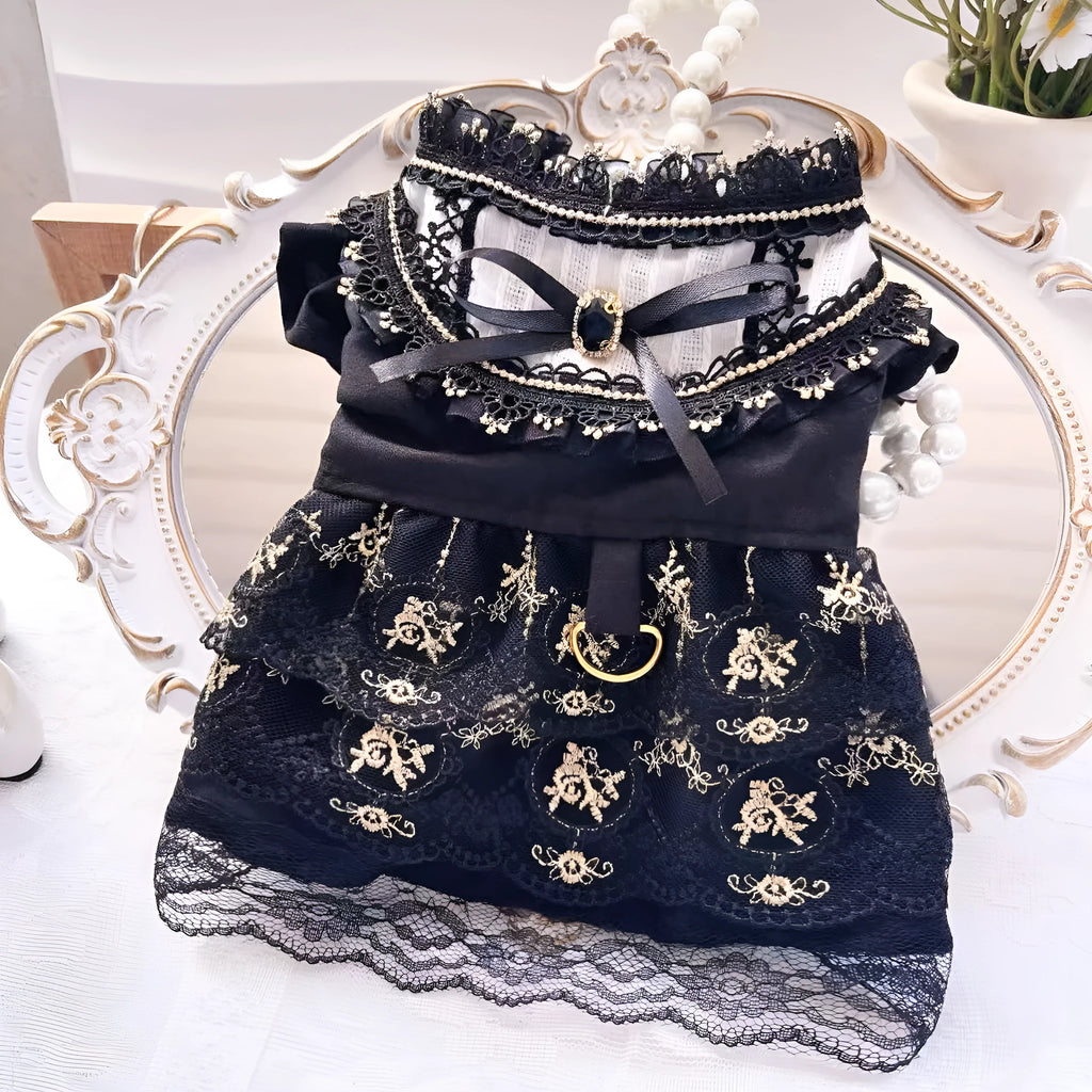 Golden tiered gothic-style skirt for a small dog on a mannequin, showing princess design.