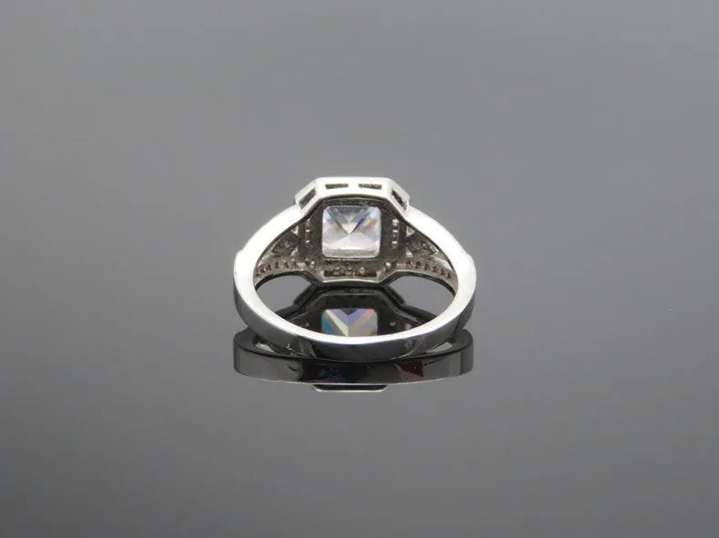 Geometric women's zircon ring with hollow design and platinum-colour finish shown from multiple angles