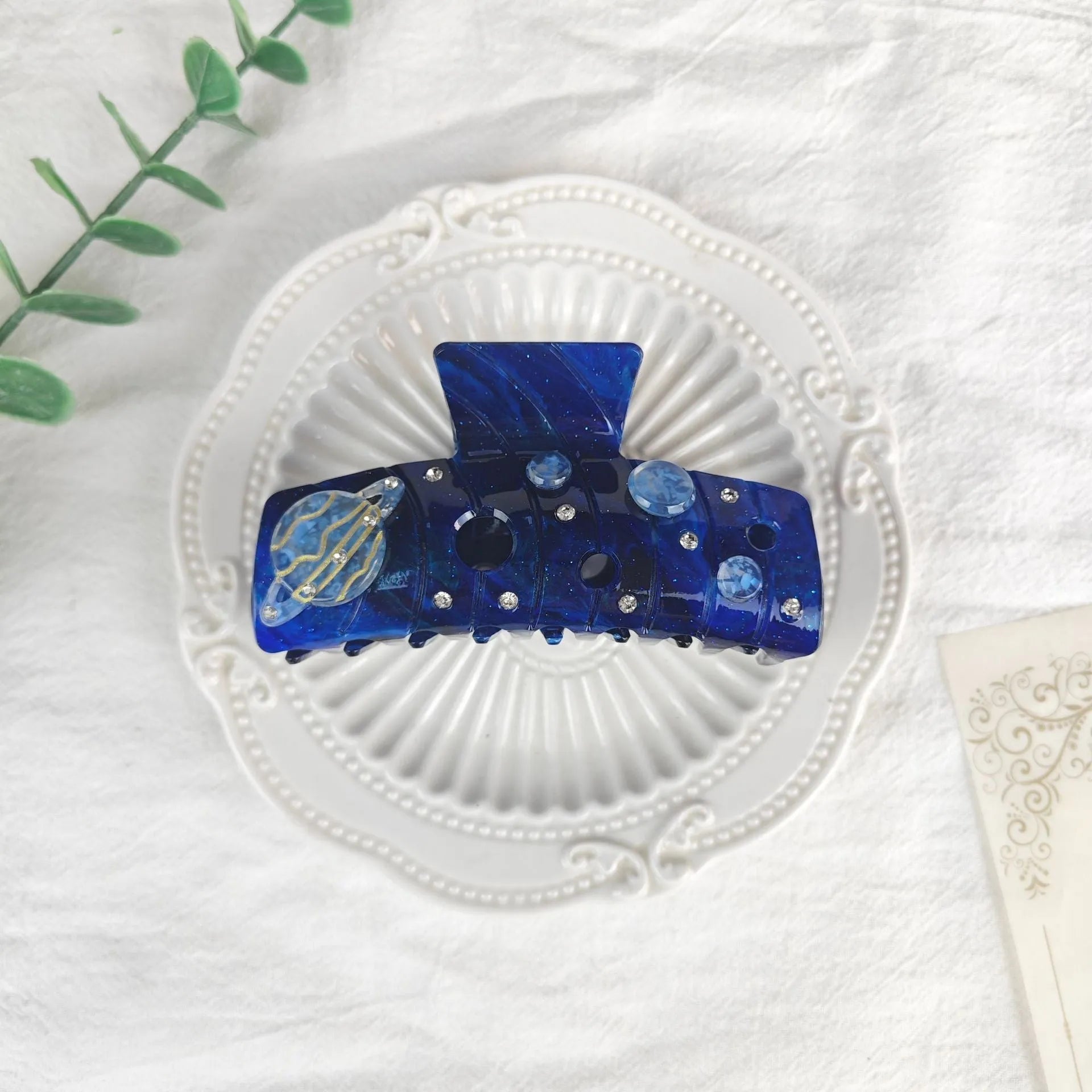 Oversized star moon barrettes with starry sky patterns in multiple colour options