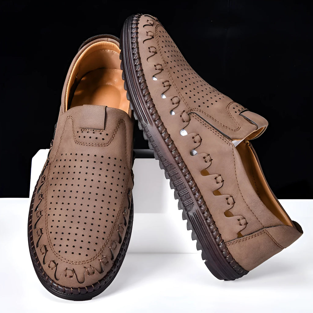 Men's brown slip-on casual shoes with round toe, sewing line detail, and flat PVC sole.