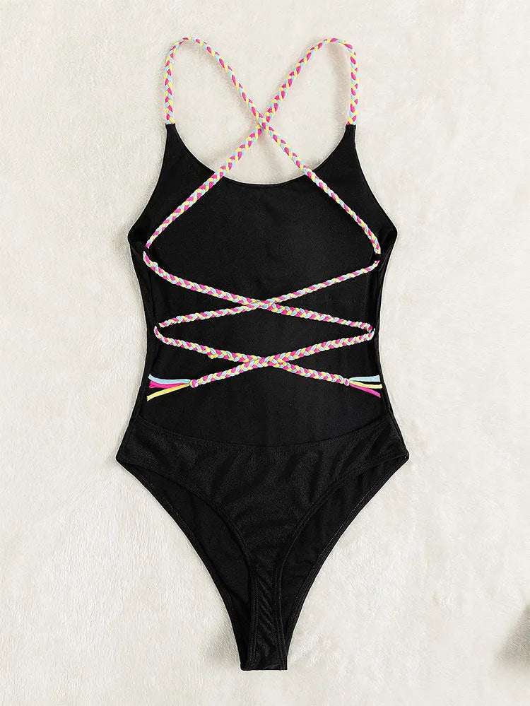 Black solid colour one-piece swimsuit with a backless and sleeveless design on a mannequin.