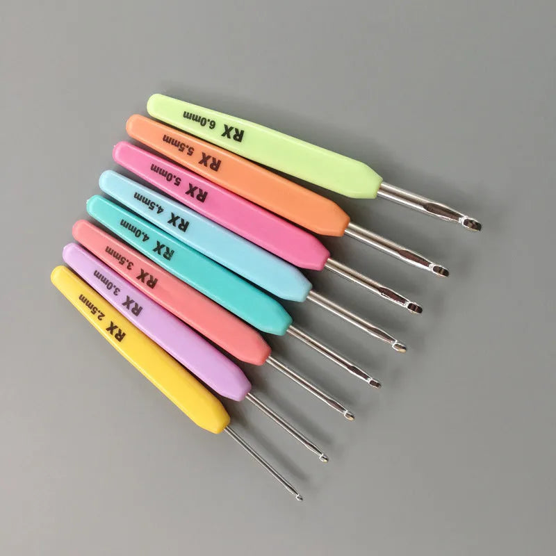 Set of 16 crochet hooks with different coloured handles in a grey PU storage bag