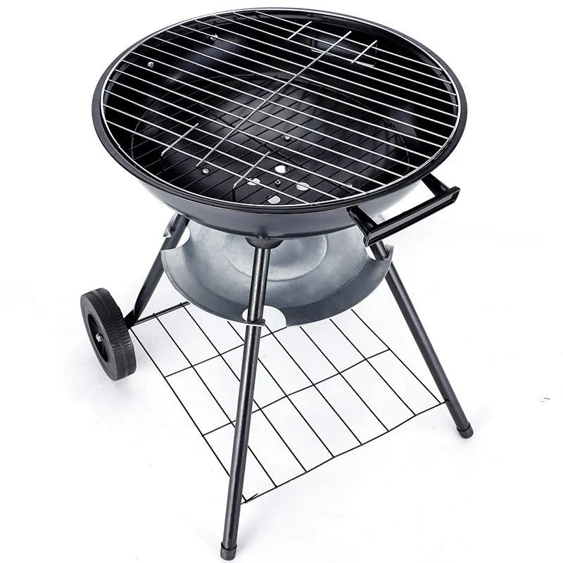 Portable round iron barbecue grill with 14-inch cooking grate, shown on a patio.
