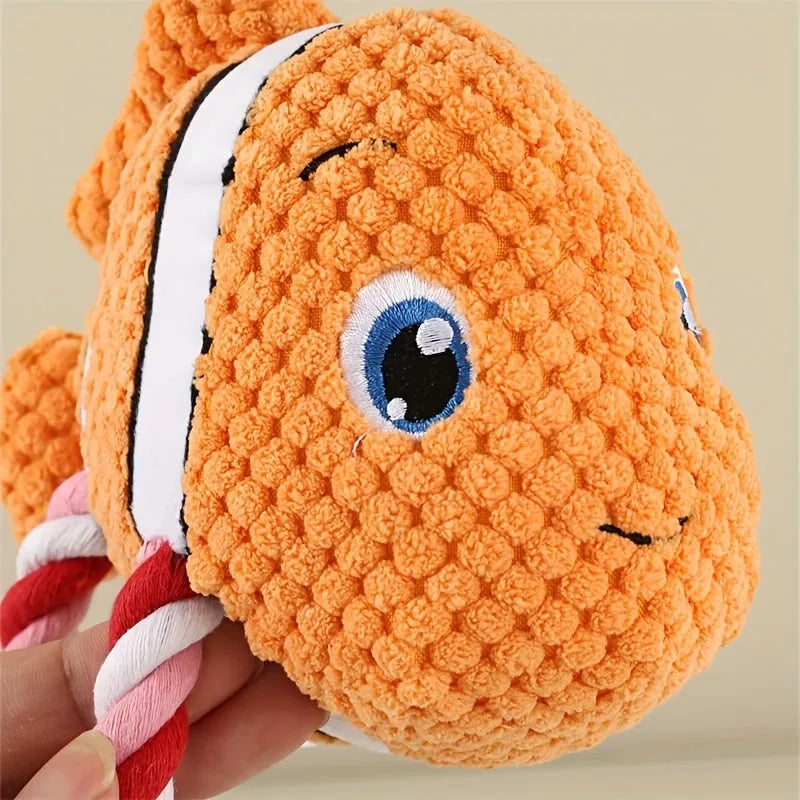 Grey turtle-shaped plush dog toy with green knotted rope limbs for chewing