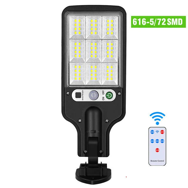 Outdoor solar LED wall lamp 28LED variant mounted on a garden fence for patio lighting
