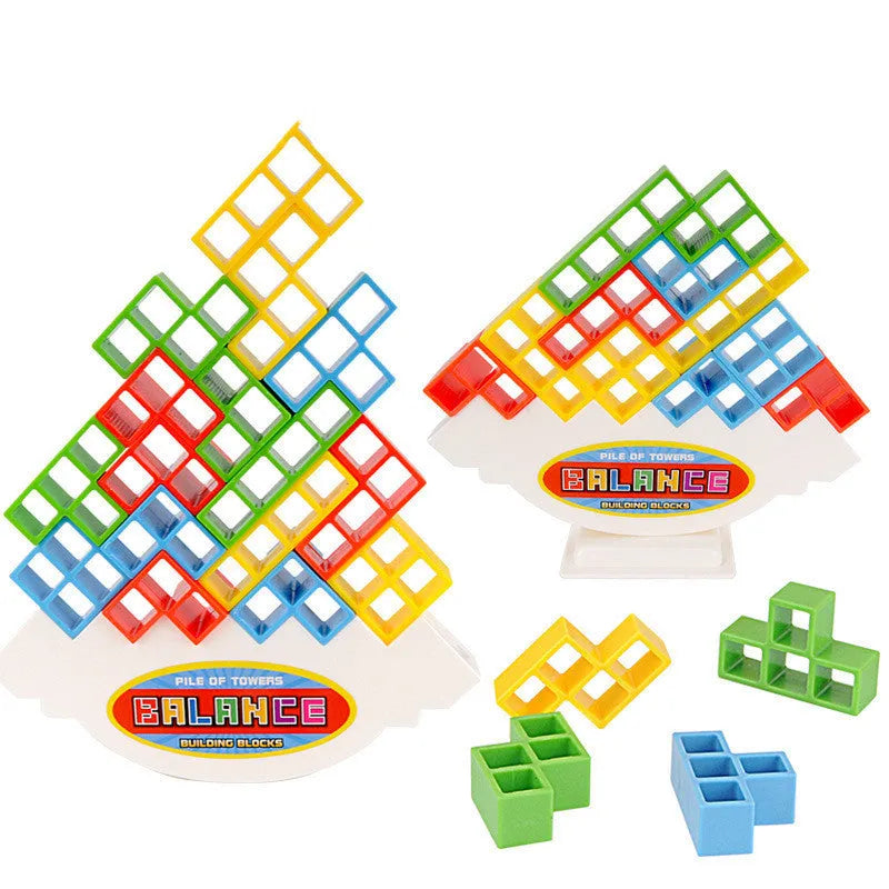 Plastic balance stacking game with coloured blocks on a tilting base, packed in a 26.5 cm box.