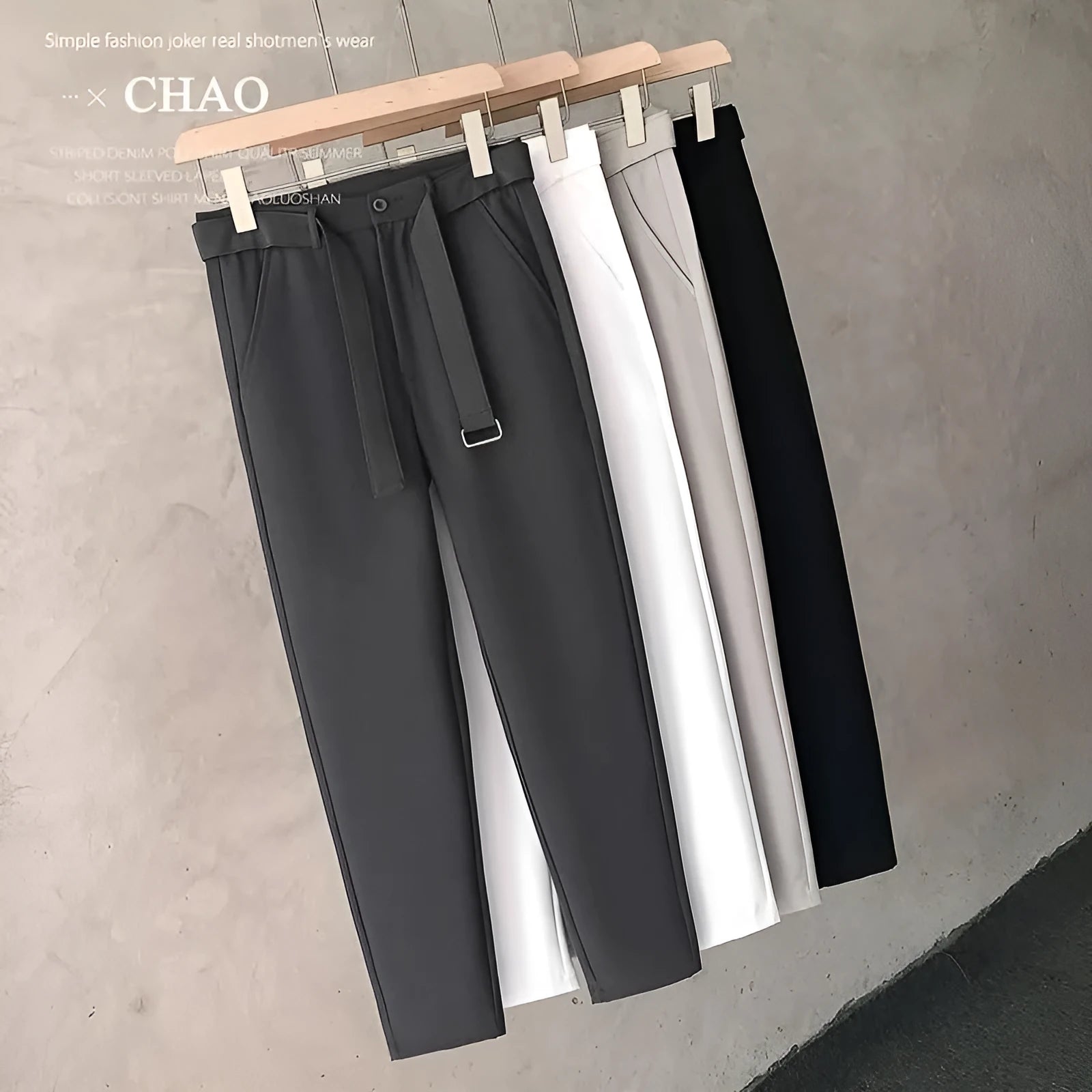 Boy wearing slim straight grey wool blend trousers in a business casual style.