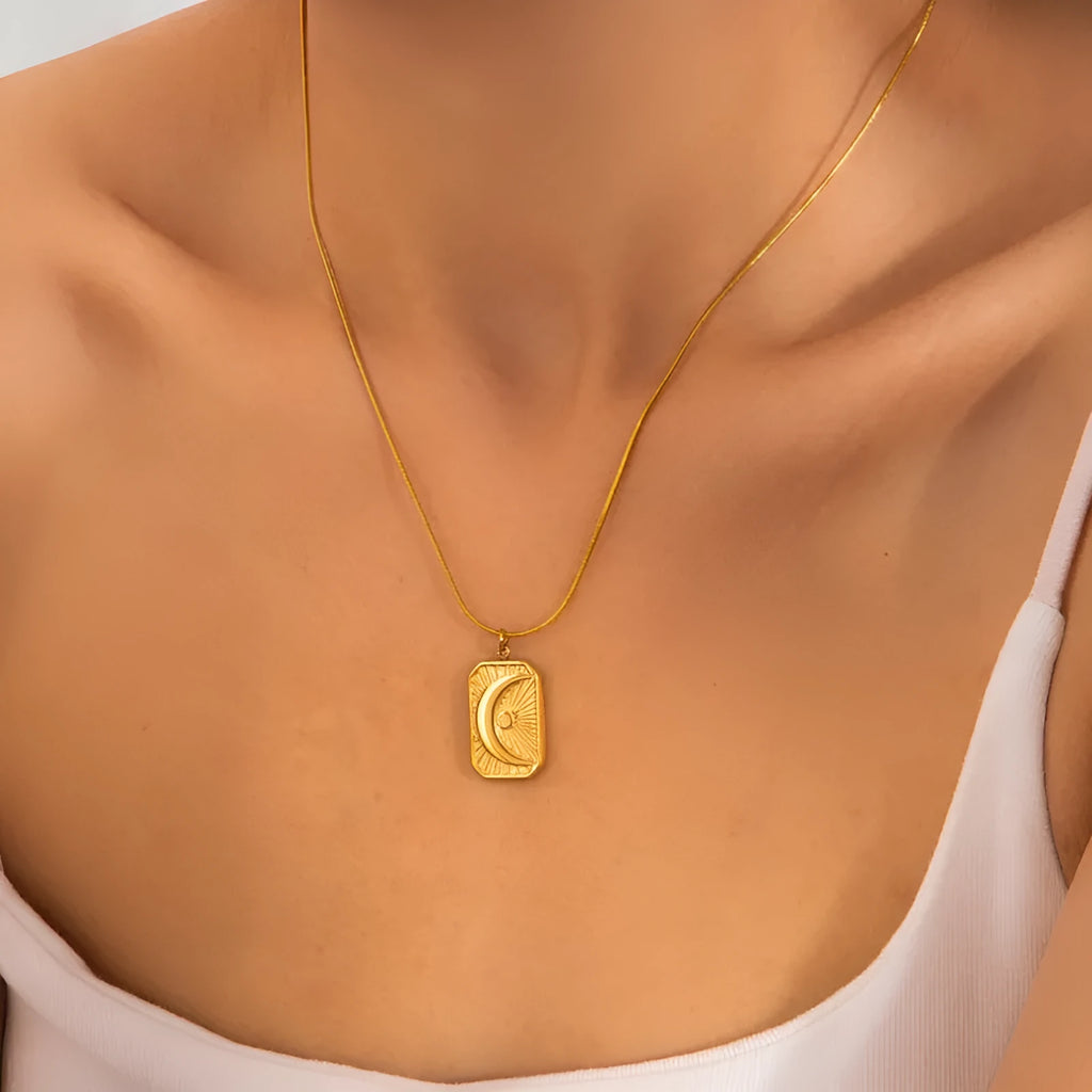 Women's titanium steel moon pendant necklace with pearl and bow detail on a 41-50cm clavicle chain