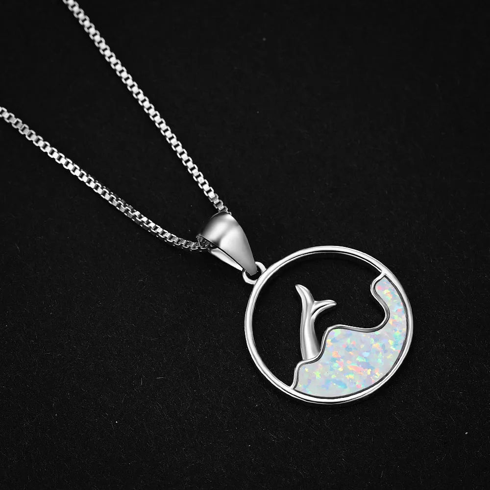 Geometric sea fishtail pendant necklace in electroplated blue opal colour on a copper chain.
