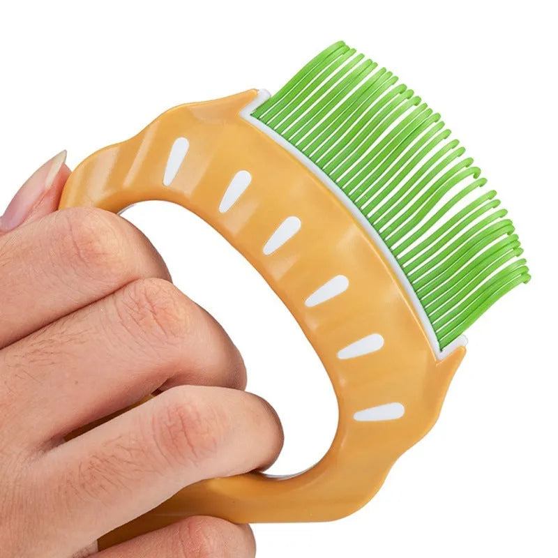 Shell-shaped plastic pet grooming brush with bent wire bristles in green, orange, or purple colours