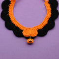 Hand-crocheted wool Halloween pet collar in pumpkin colours with adjustable sizing for cats and dogs