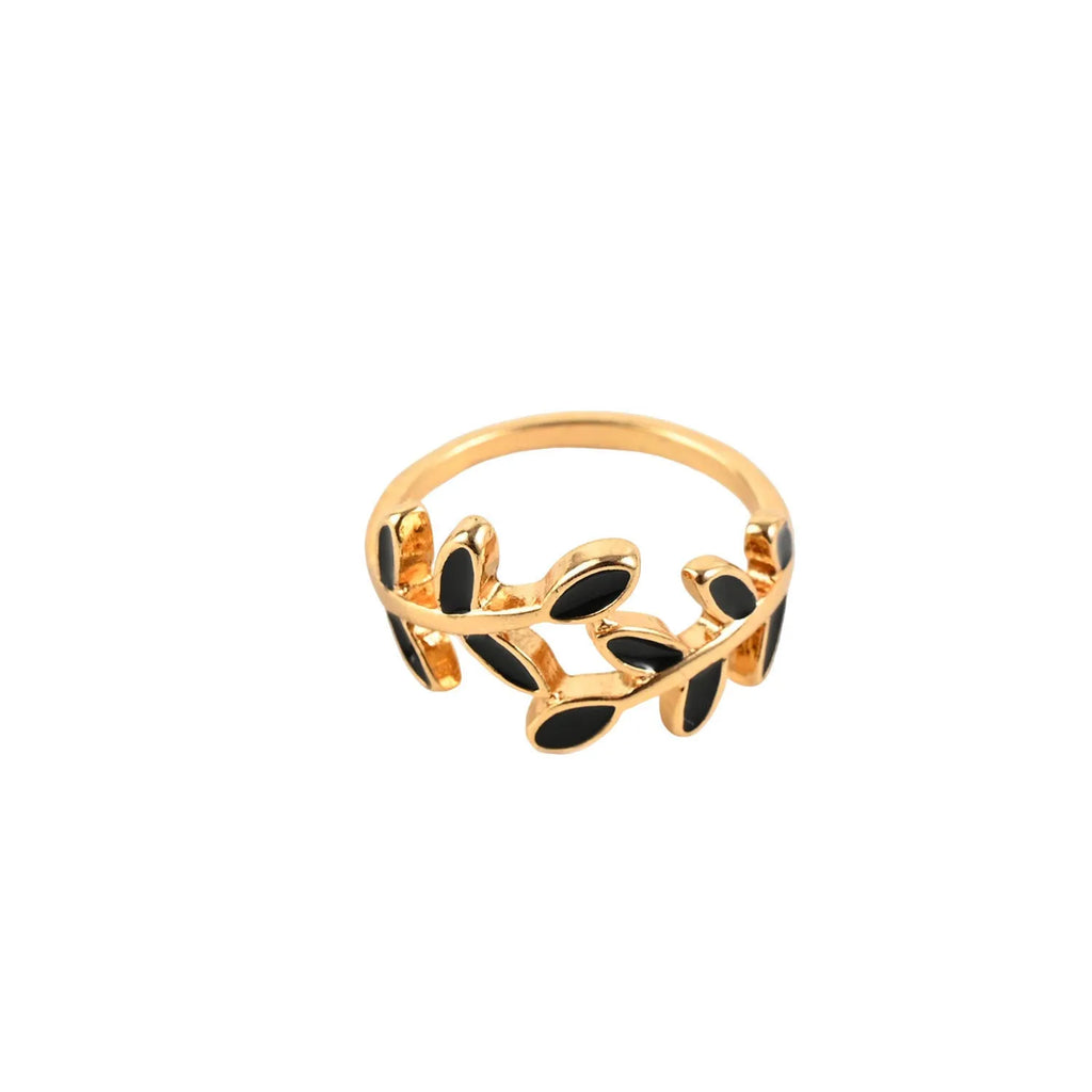 Gold-coloured acrylic ring with a floral shape and leaf geometric design details.
