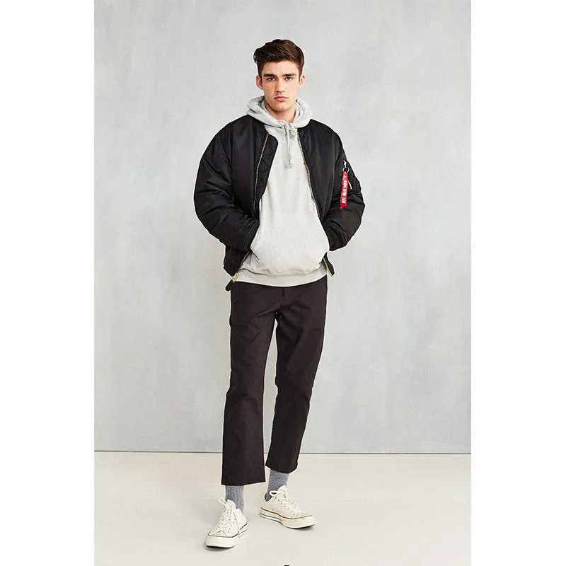 Men's army green cotton-padded pilot jacket with double-sided nylon construction on a hanger.