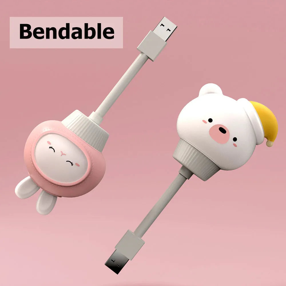USB portable LED night light with remote control in cartoon bear design on bedside table