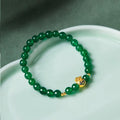 Green turquoise bead bracelet with 8mm geometric beads and silver accent