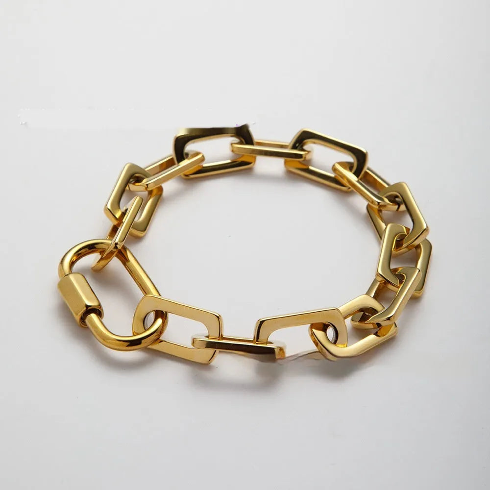Women's titanium steel carabiner bracelet with ellipse design in gold or silver electroplated finish