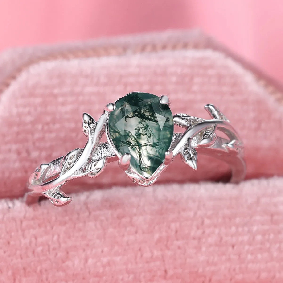 S925 silver ring with drop-shaped natural agate stone and branch leaf edge design on white background