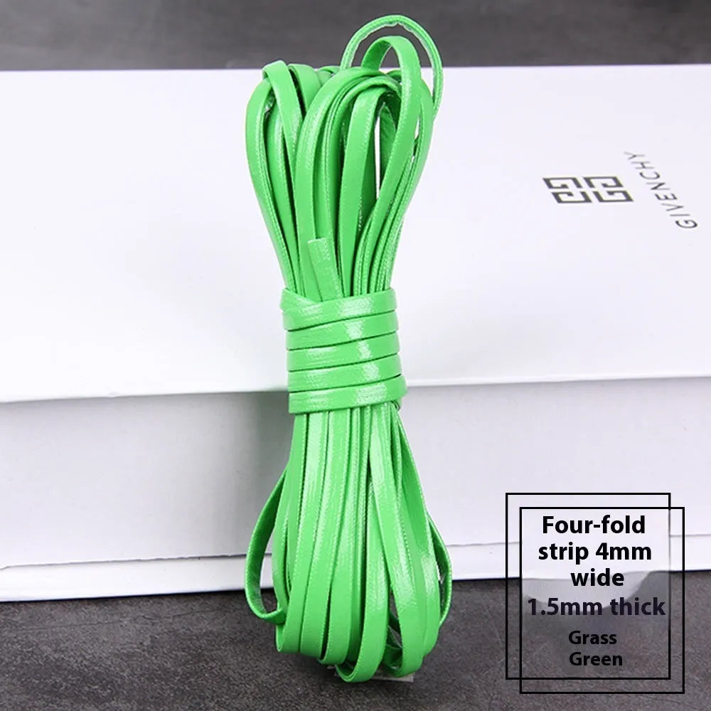 Coils of woven PU leather craft cord in various colours including black, brown, blue, red, and gold.