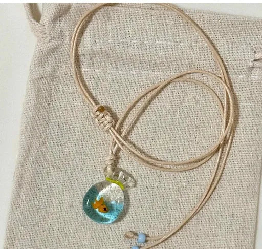Women's joker pendant necklace on braided cotton linen cord with adjustable lobster clasp.