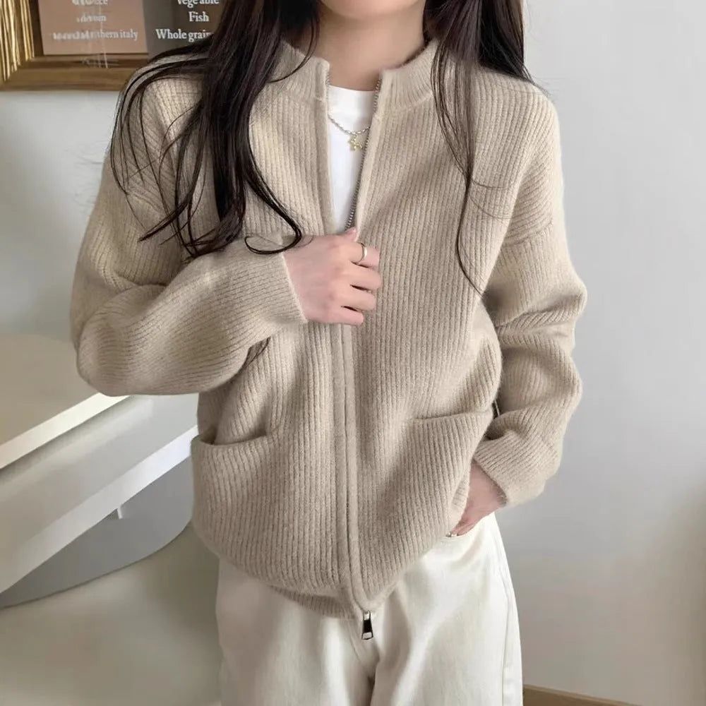 Beige viscose soft sweater coat cardigan with long sleeves on a hanger
