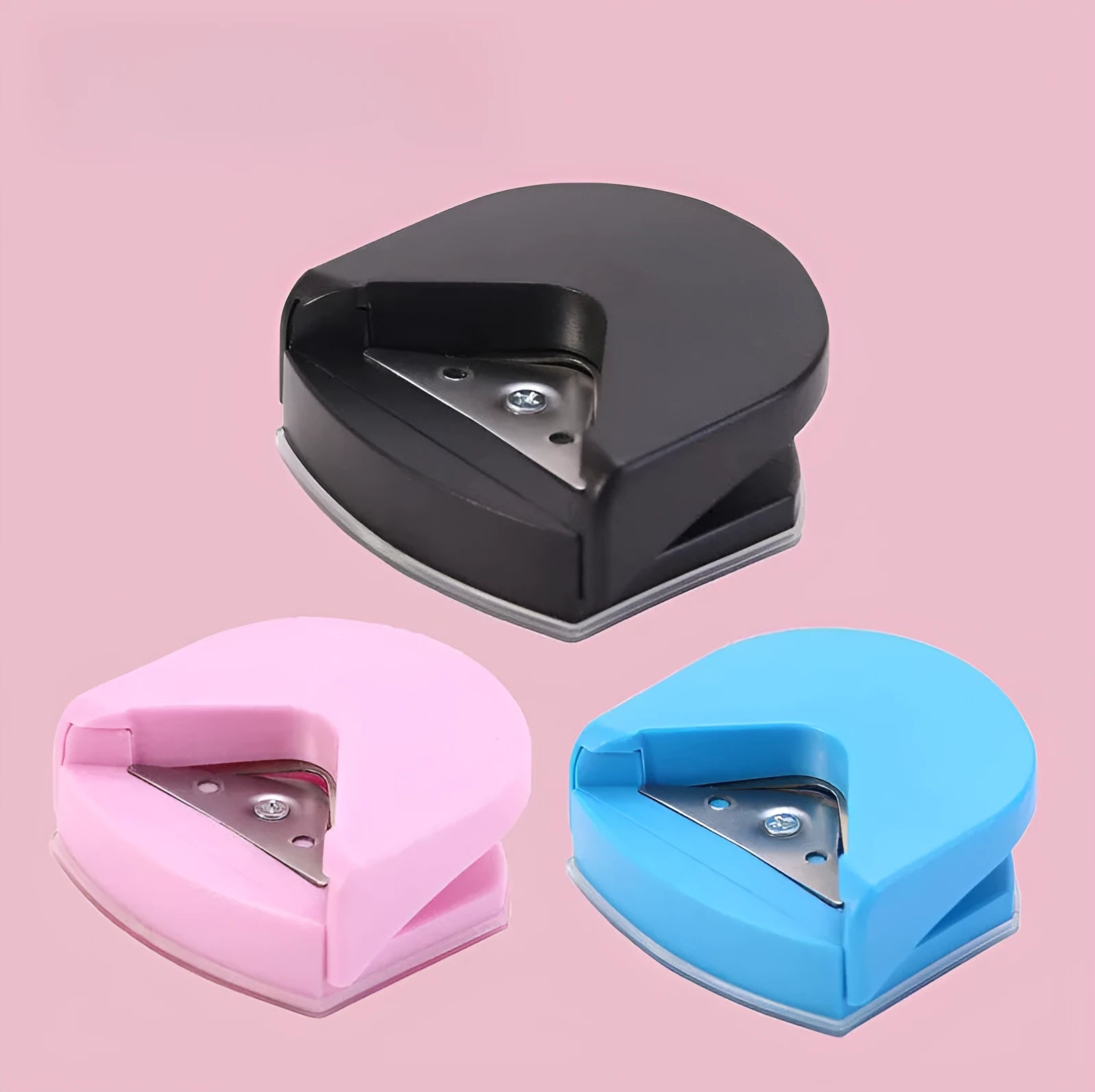 Business card corner cutter in black, blue, or pink colours showing plastic and metal construction