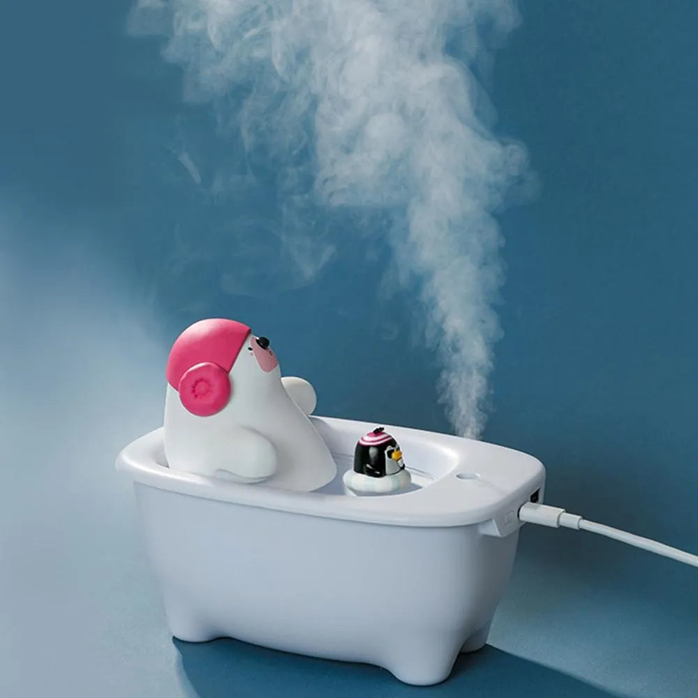 White USB air humidifier and essential oil diffuser with 550ml water tank on a desk.