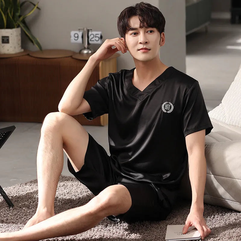 Men's loose fit ice silk short-sleeve pajama shirt and shorts set on a hanger.