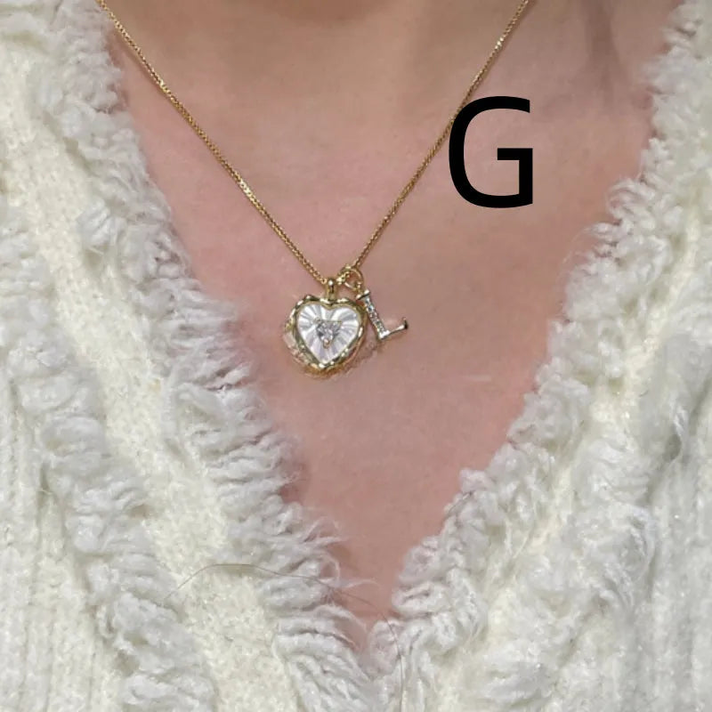 Women's pendant necklace with titanium steel chain and natural mother-of-pearl in heart-shaped design