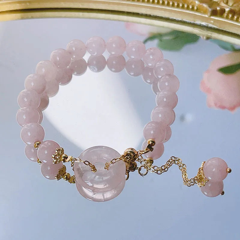 Pink crystal women's bracelet with peace buckle clasp and adjustable closure