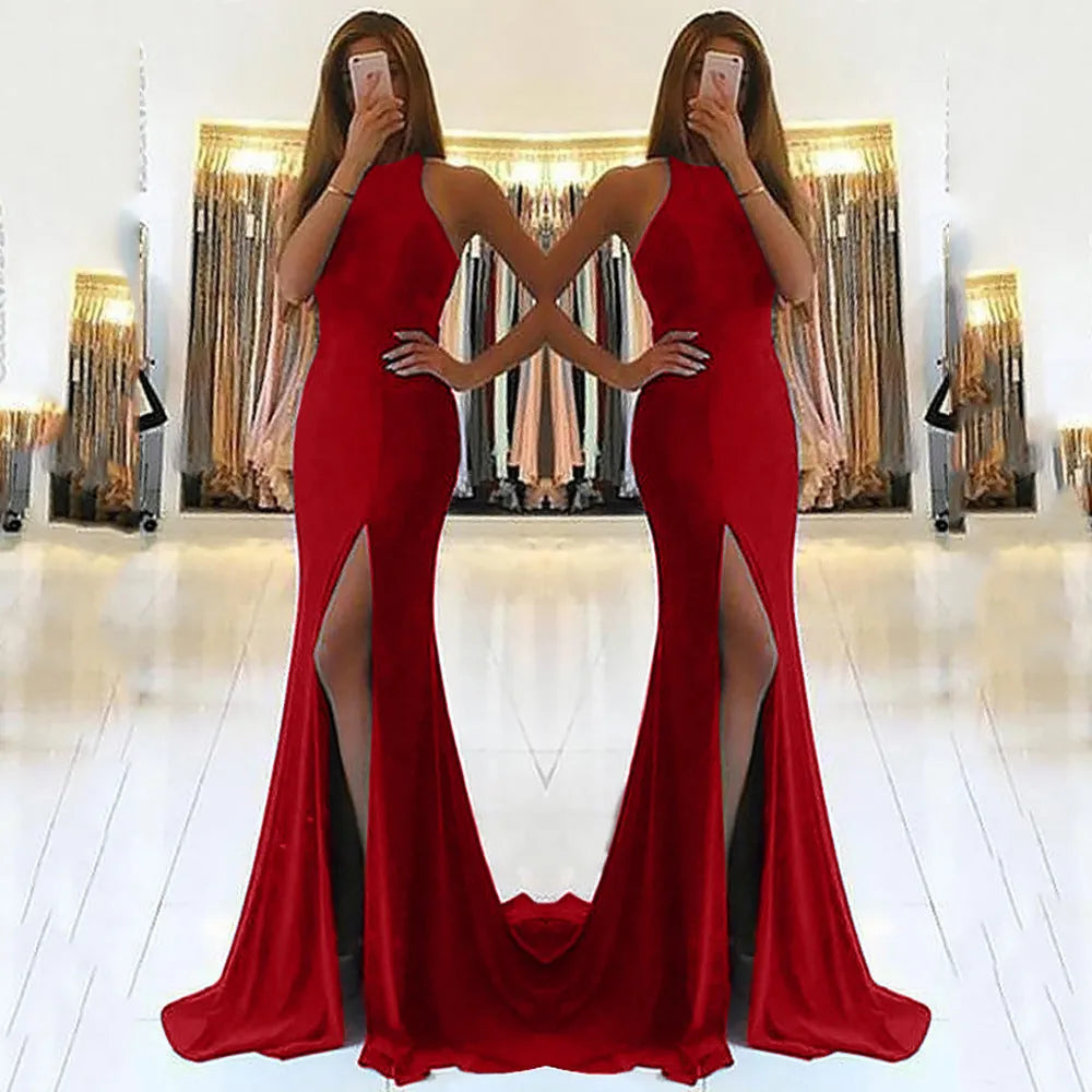 Long red knitting fabric evening dress with large swing skirt, high waist, hollow detail, and hanging neckline.
