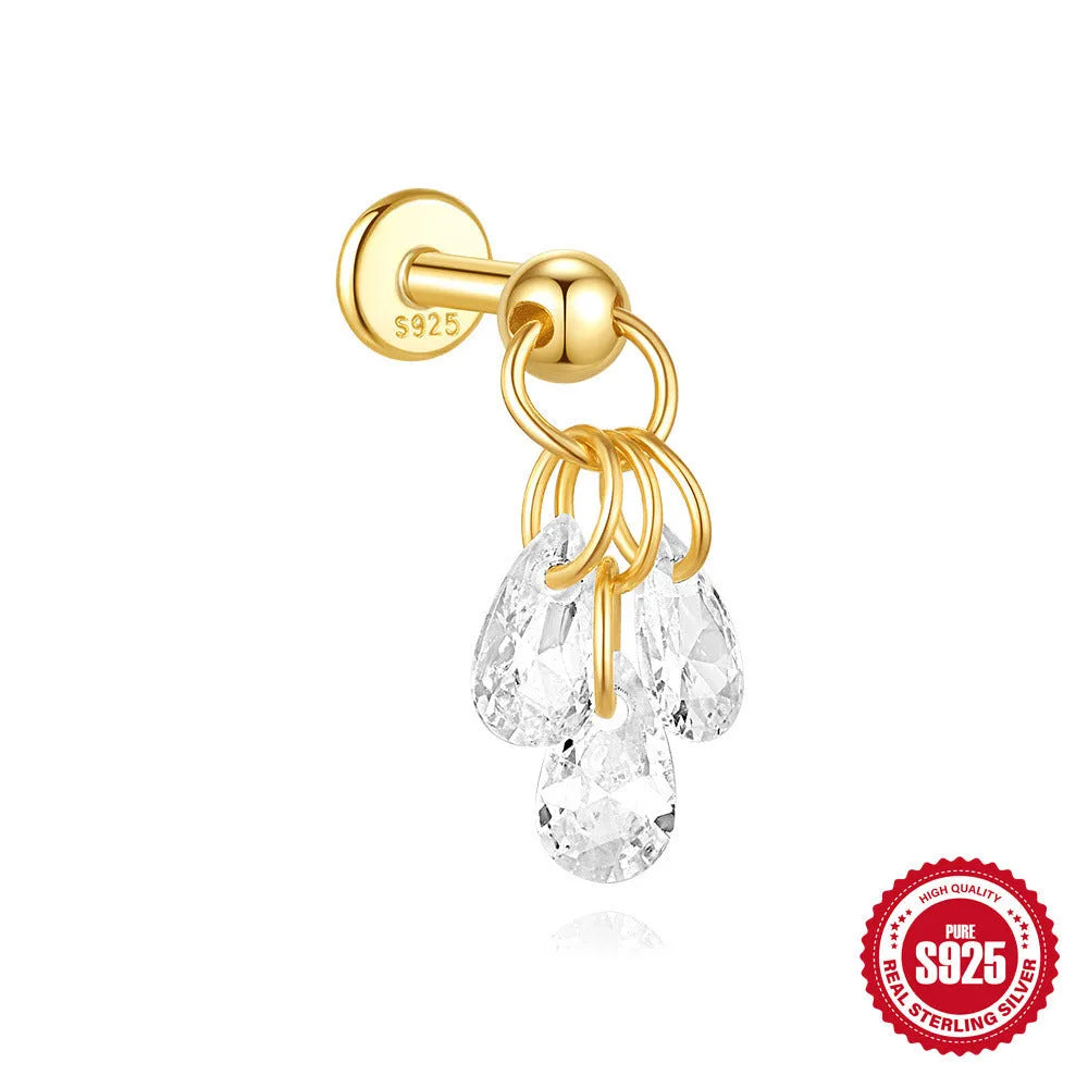 S925 sterling silver geometric moon and star earrings with diamond detail on a gold tone background.