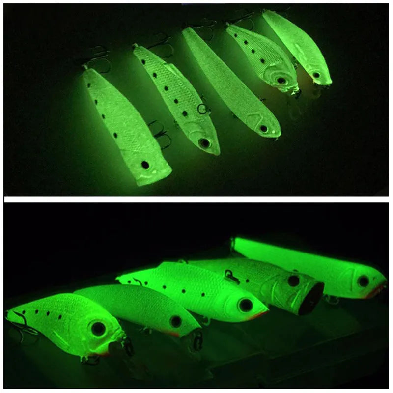 Set of five fluorescent green and orange 3D hard bait fishing lures on a blue background.