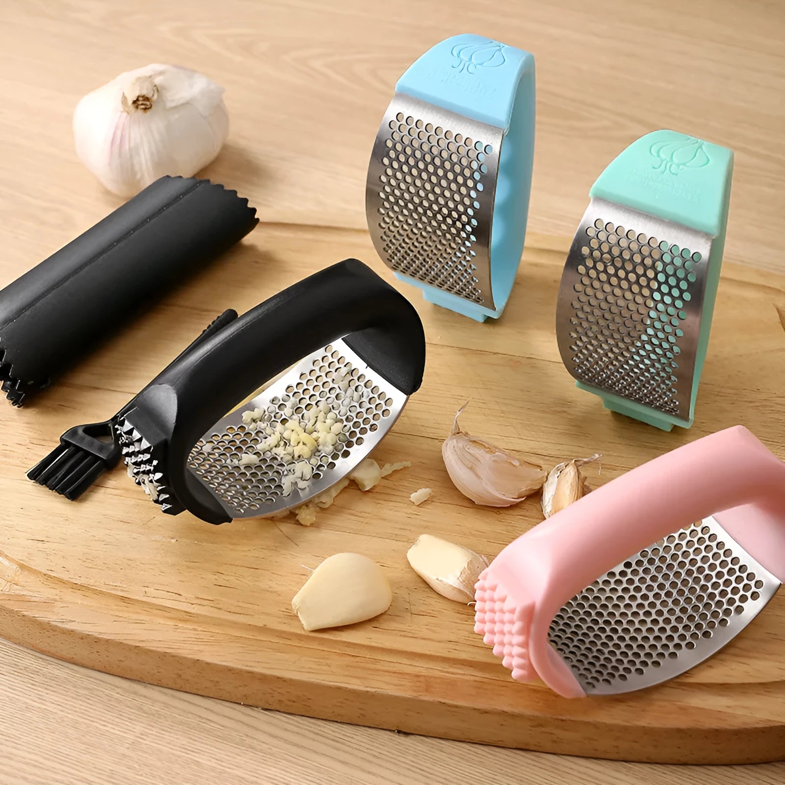 Stainless steel garlic press with polypropylene handles in modern design