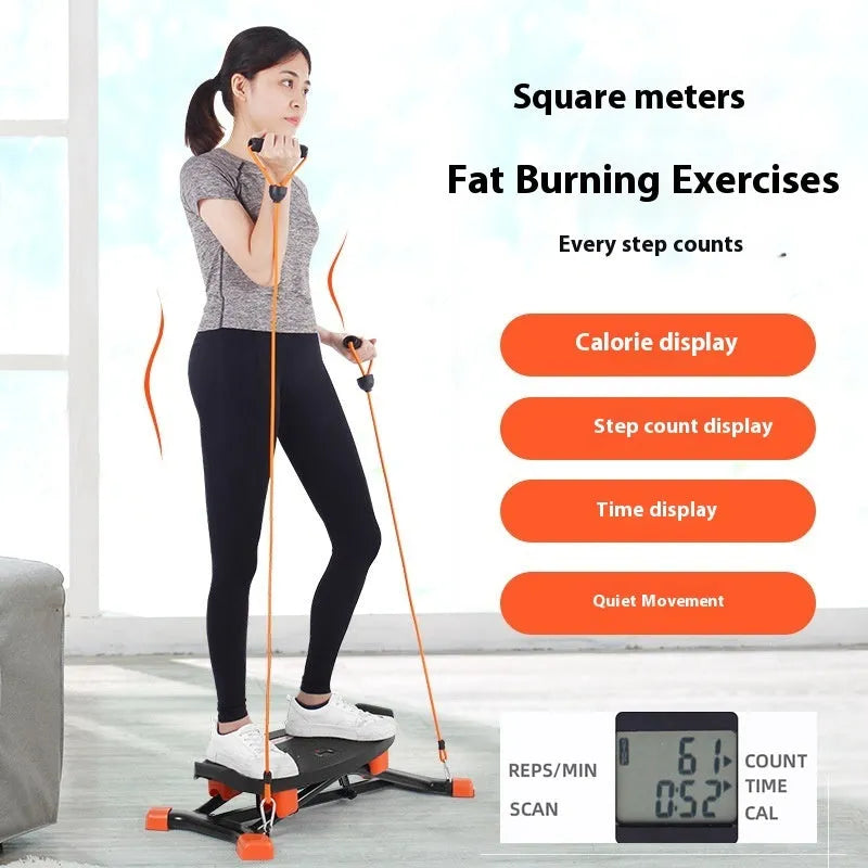 Black mini indoor fitness skiing machine with elastic hand straps on a home floor.