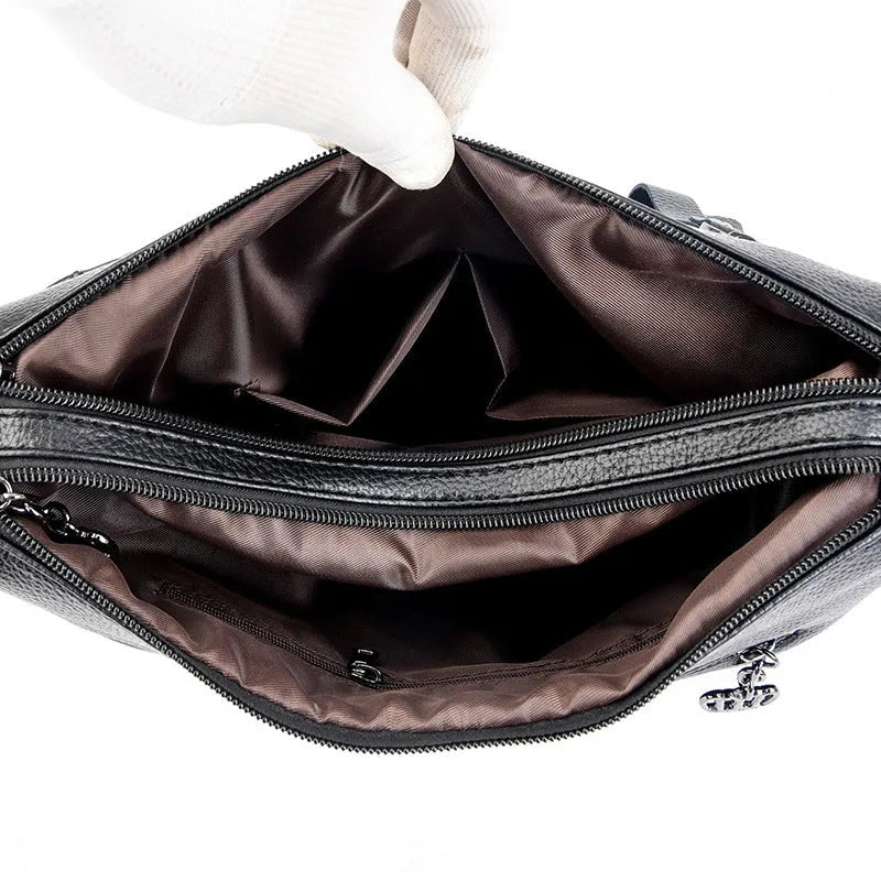 Genuine leather cross-body messenger bag in horizontal square shape with internal organisers