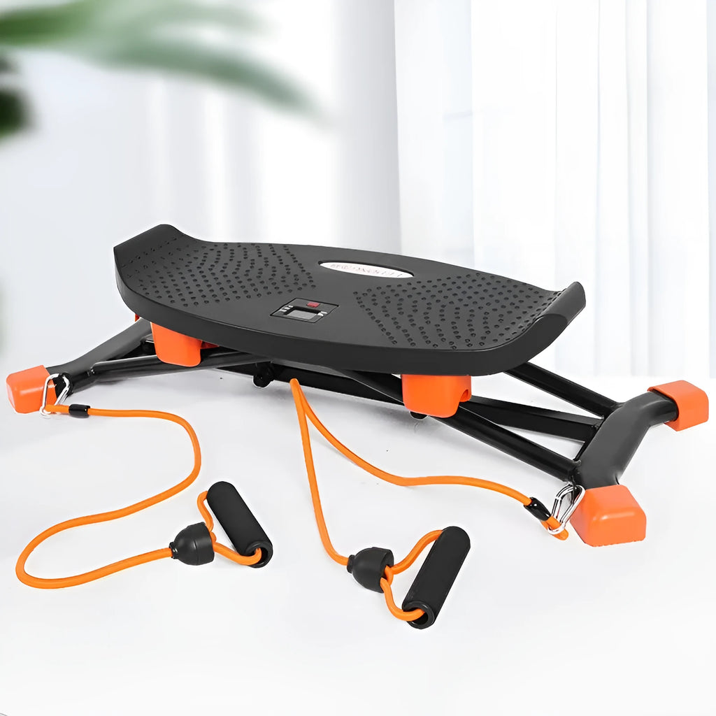 Black mini indoor fitness skiing machine with elastic hand straps on a home floor.