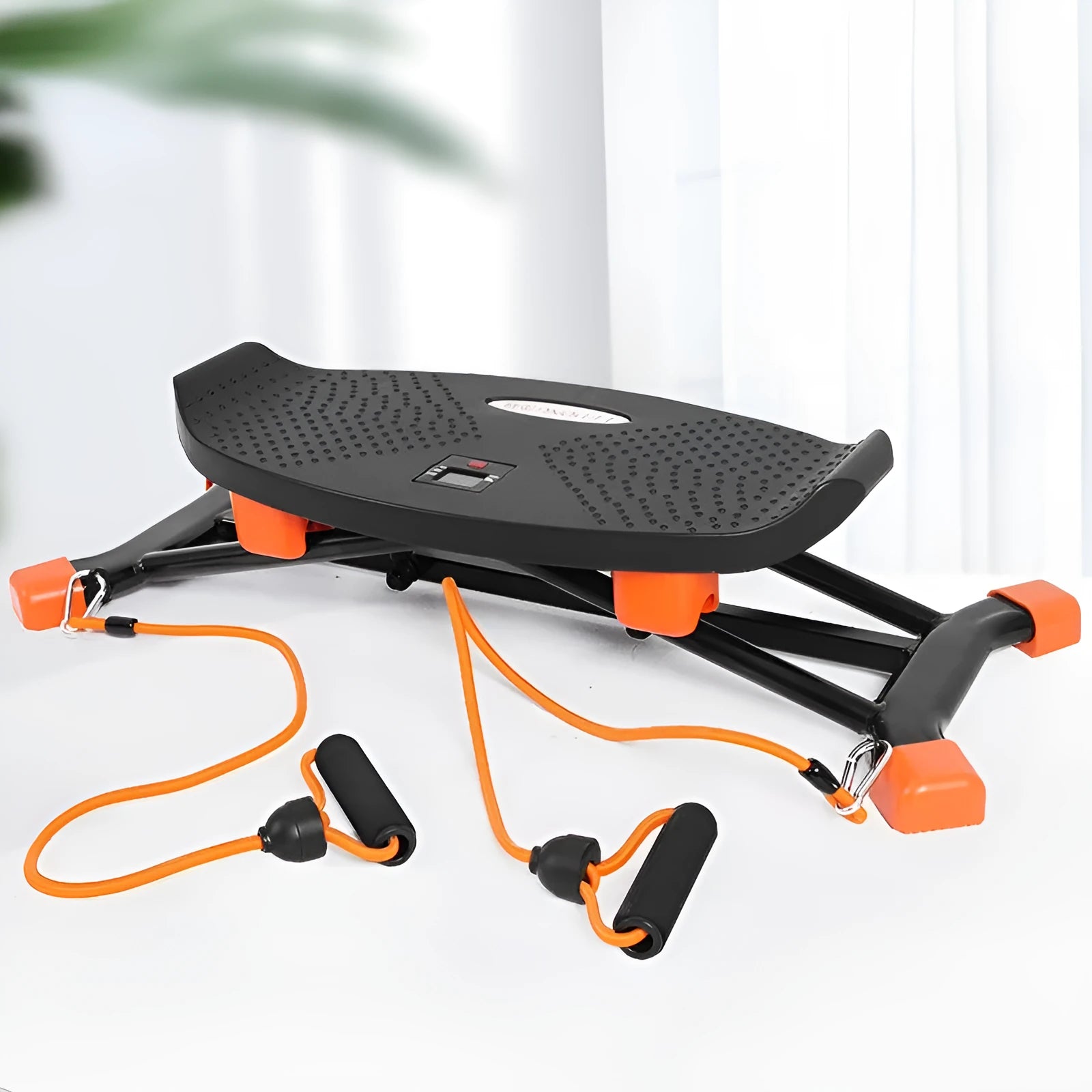 Black mini indoor fitness skiing machine with elastic hand straps on a home floor.