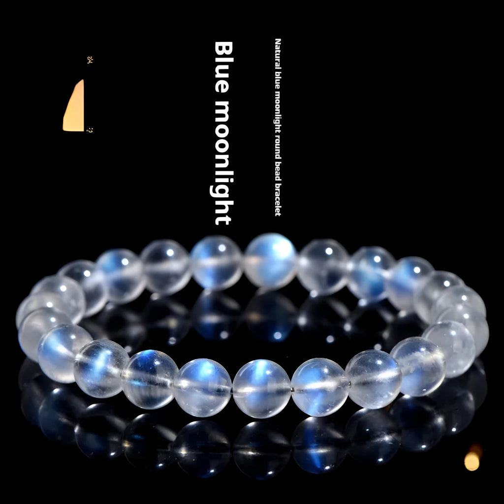 Natural cream coloured Blue Moonlight crystal bracelet on a wrist, showing minimalist unisex design.