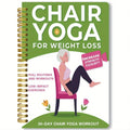 Green coil-bound yoga training notebook showing 30-day calendar pages and yoga programme content